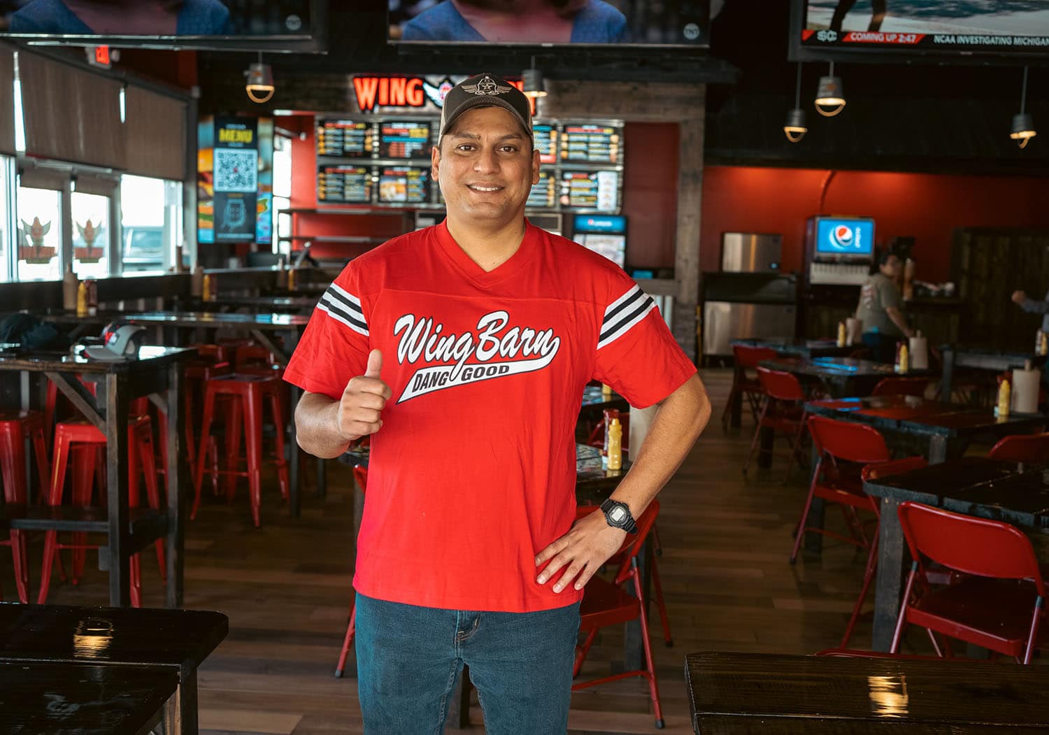 Wing Barn red jersey shirt with black sleeve stripes