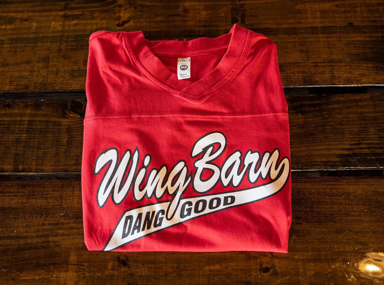 Wing Barn red t-shirt with cursive "Wing Barn Dang Good" logo